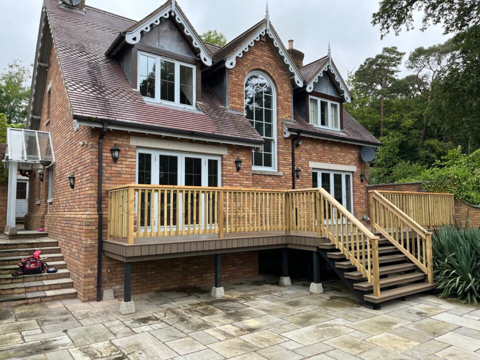 Composite Decking Transformation with Bespoke Timber Handrail – Storm Dekorators Venture Composite Decking In Sandbar Colour front view 2