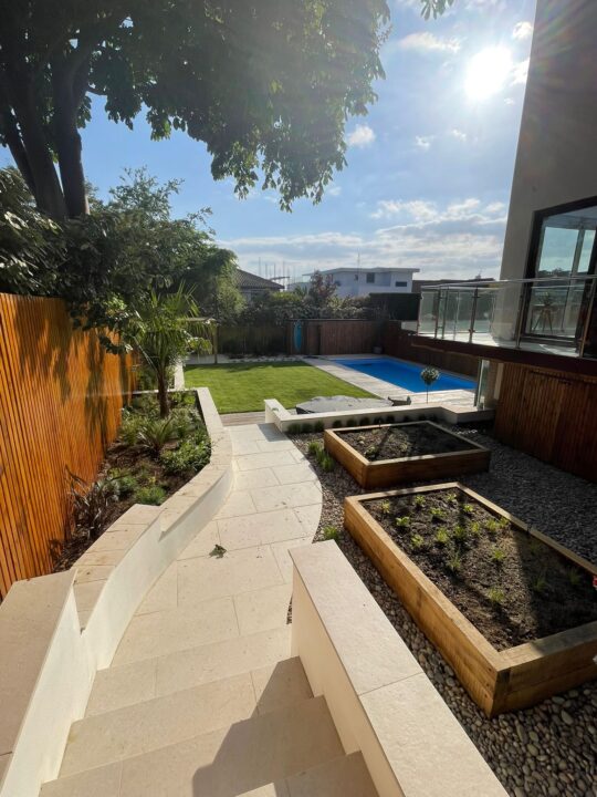 premium porcelain patio stair case leading down to composite decking in sandbanks poole