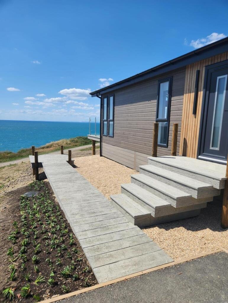Millboard Weathered oak- Driftwood - west bay bridport decking installation 4 Millboard Weathered oak- Driftwood - west bay bridport decking installation 4