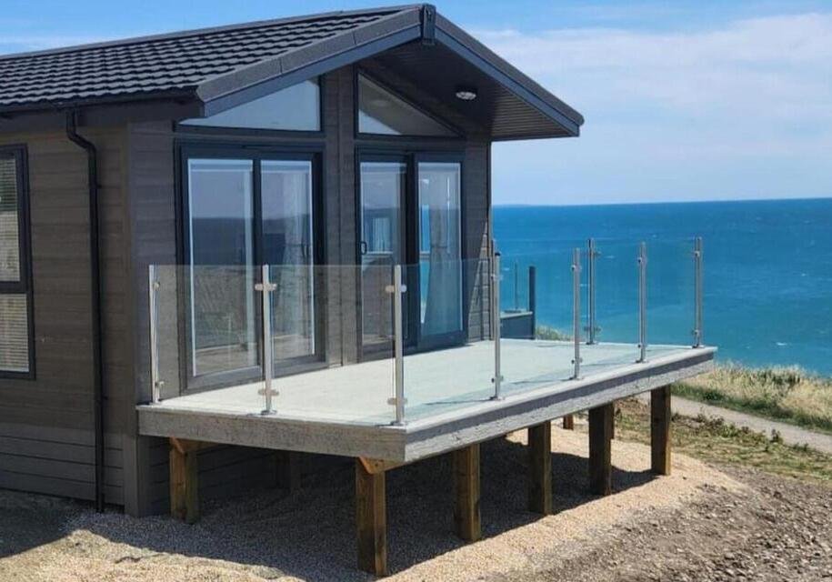 Millboard Weathered oak- Driftwood - west bay bridport decking installation 1.1 Millboard Weathered oak- Driftwood - west bay bridport decking installation 1.1